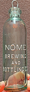 NOME BREWING AND BOTTLING COMPANY EMBOSSED BEER BOTTLE
