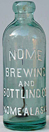 NOME BREWING AND BOTTLING COMPANY EMBOSSED BEER BOTTLE