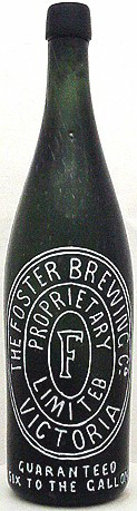 THE FOSTER BREWING COMPANY EMBOSSED BEER BOTTLE