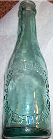 M. V. COMPANY AND HORONDA BREWERY EMBOSSED BEER BOTTLE