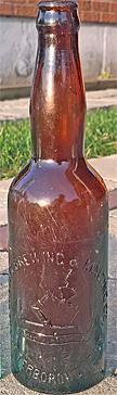 CALCUTT BREWING & MALTING COMPANY EMBOSSED BEER BOTTLE