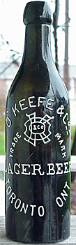 O'KEEFE & COMPANIES LAGER BEER EMBOSSED BEER BOTTLE