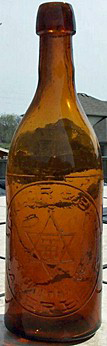 TAYLOR & BATE LAGER BEER EMBOSSED BEER BOTTLE