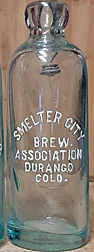 SMELTER CITY BREWING ASSOCIATION EMBOSSED BEER BOTTLE