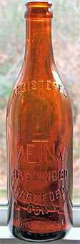 THE AETNA BREWING COMPANY EMBOSSED BEER BOTTLE