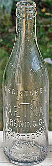 THE AETNA BREWING COMPANY EMBOSSED BEER BOTTLE