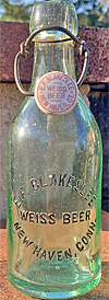 E. F. BLAKESLEE WEISS BEER EMBOSSED BEER BOTTLE