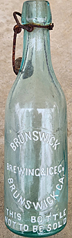 BRUNSWICK BREWING & ICE COMPANY EMBOSSED BEER BOTTLE
