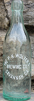 THE P. H. WOLTERS BREWING COMPANY EMBOSSED BEER BOTTLE