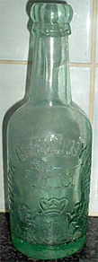 ALNWICK BREWERY COMPANY LIMITED EMBOSSED BEER BOTTLE