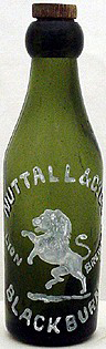 NUTTALL & COMPANY LIMITED LION BREWERY EMBOSSED BEER BOTTLE