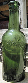 THE WEST CHESHIRE BREWERY COMPANY LIMITED EMBOSSED BEER BOTTLE