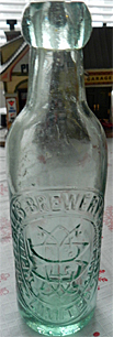 THRELFALLS BREWERY COMPANY LIMITED EMBOSSED BEER BOTTLE