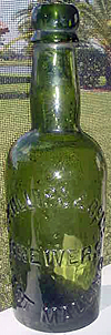 T. PHILLIPS & COMPANY LIMITED BREWERS EMBOSSED BEER BOTTLE