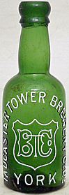 TADCASTER TOWER BREWERY COMPANY LIMITED EMBOSSED BEER BOTTLE
