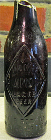 J. A. LOMAX DIAMOND LAGER BEER EMBOSSED BEER BOTTLE