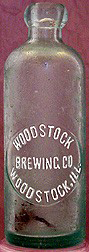 WOODSTOCK BREWING COMPANY EMBOSSED BEER BOTTLE