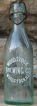 WOODSTOCK BREWING COMPANY EMBOSSED BEER BOTTLE