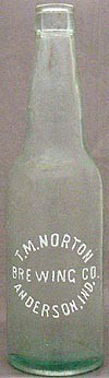 T. M. NORTON BREWING COMPANY EMBOSSED BEER BOTTLE