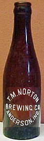 T. M. NORTON BREWING COMPANY EMBOSSED BEER BOTTLE