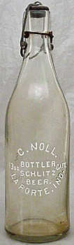 C. NOLL BOTTLER SCHLITZ BEER EMBOSSED BEER BOTTLE