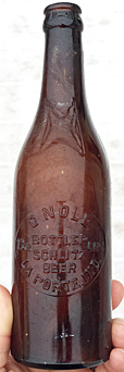 C. NOLL BOTTLER SCHLITZ BEER EMBOSSED BEER BOTTLE