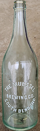 THE MUESSEL BREWING COMPANY EMBOSSED BEER BOTTLE