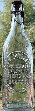 E. M. SWEENEY BEER DEALER EMBOSSED BEER BOTTLE
