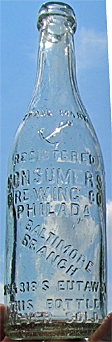 CONSUMERS BREWING COMPANY EMBOSSED BEER BOTTLE