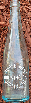 MIDDLE WEST BREWING COMPANY EMBOSSED BEER BOTTLE