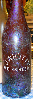 J. W. HUTTY WEISS BEER EMBOSSED BEER BOTTLE