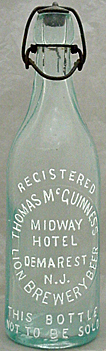 THOMAS McGUINNESS MIDWAY HOTEL LION BREWERY BEER EMBOSSED BEER BOTTLE