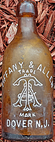 TIFFANY & ALLEN GOLDEN LAGER EMBOSSED BEER BOTTLE