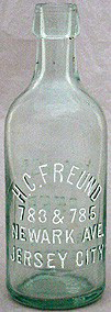 H. C. FREUND WEISS BEER EMBOSSED BEER BOTTLE