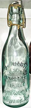 JOSEPH HARTH PROSPECT PLACE BREWERY EMBOSSED BEER BOTTLE
