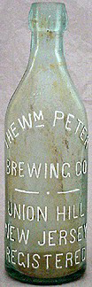 THE WILLIAM PETER BREWING COMPANY EMBOSSED BEER BOTTLE