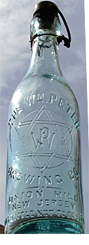 THE WILLIAM PETER BREWING COMPANY EMBOSSED BEER BOTTLE