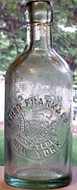 FRED. FRANK & COMPANY WEISS BEER EMBOSSED BEER BOTTLE