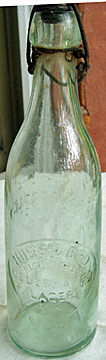 HUSS & BROTHER CELEBRATED LAGER EMBOSSED BEER BOTTLE