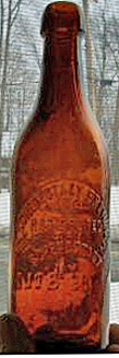 THE SCHENECTADY BREWING COMPANY EMBOSSED BEER BOTTLE