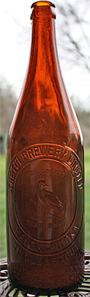 THE TUI BREWERY LIMITED EMBOSSED BEER BOTTLE