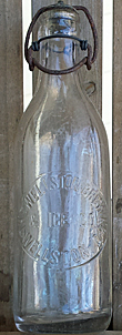 THE WELLSTON BREWING & ICE COMPANY EMBOSSED BEER BOTTLE