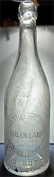 THE MUTUAL BREWING COMPANY EMBOSSED BEER BOTTLE