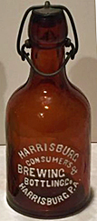 THE HARRISBURG CONSUMERS BREWING & BOTTLING COMPANY EMBOSSED BEER BOTTLE