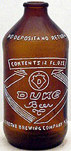 DUQUESNE BREWING COMPANY DUKE BEER EMBOSSED BEER BOTTLE