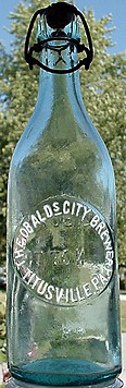 THEOBALDS CITY BREWERY EMBOSSED BEER BOTTLE