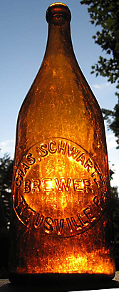 CHARLES SCHWARTZ BREWER EMBOSSED BEER BOTTLE