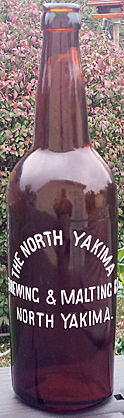 NORTH YAKIMA BREWING AND MALTING EMBOSSED BEER BOTTLE