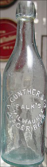 A. GUNTHER & COMPANY FALK'S MILWAUKEE LAGER BEER EMBOSSED BEER BOTTLE