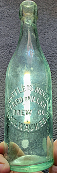 FRED MILLER BREWING COMPANY EMBOSSED BEER BOTTLE